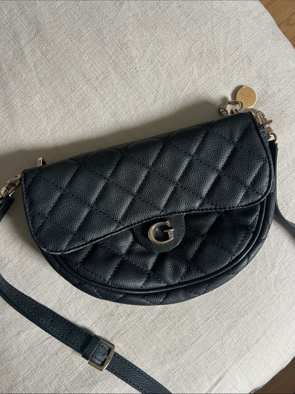 Guess Black Quilted Crossbody Saddle Bag with Gold G Hardware